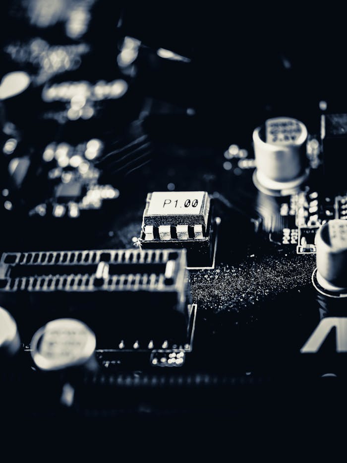 pexels-photo-7102037 Detailed macro shot of a modern computer motherboard showcasing components and circuits.
